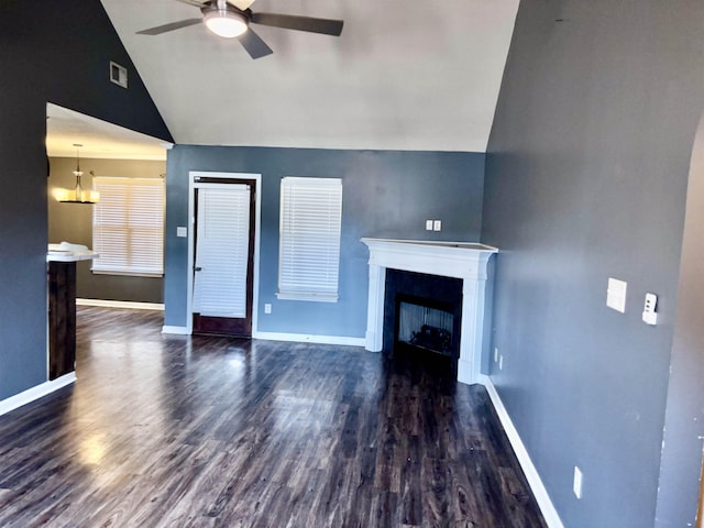 unfurnished living room featuring baseboards, visible vents, ceiling fan, wood finished floors, and a fireplace