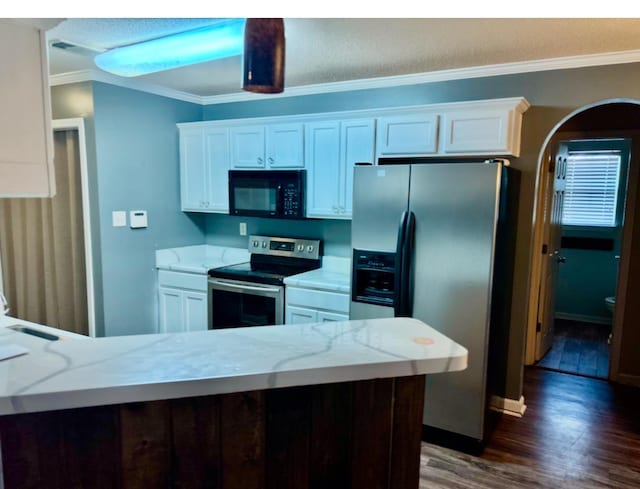 kitchen featuring light stone counters, stainless steel appliances, white cabinets, dark wood-style floors, and crown molding