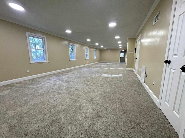 interior space featuring baseboards, recessed lighting, carpet flooring, and crown molding