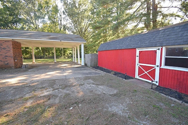 view of shed featuring driveway