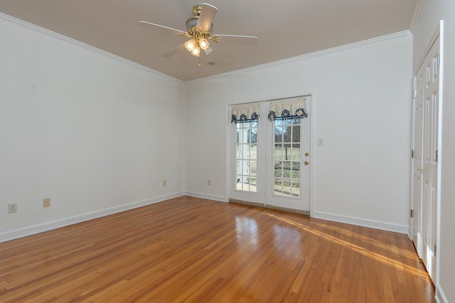 unfurnished room featuring ornamental molding, baseboards, light wood finished floors, and a ceiling fan