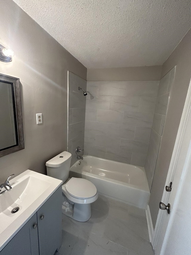 full bathroom featuring shower / bathtub combination, vanity, toilet, and a textured ceiling