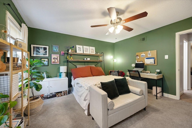 bedroom with carpet, visible vents, and baseboards