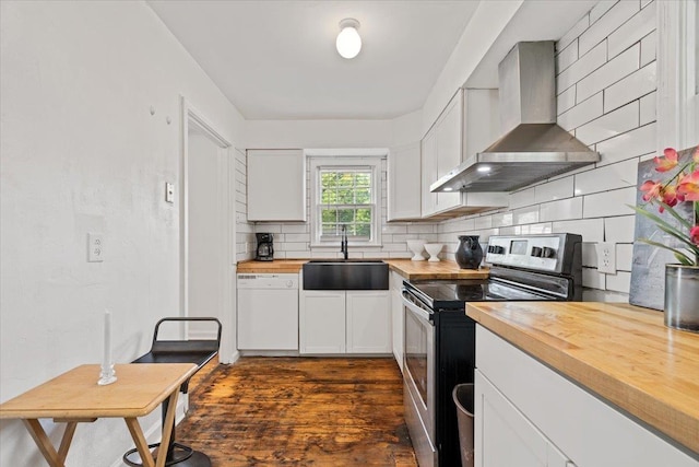 kitchen with white dishwasher, a sink, wood counters, stainless steel electric stove, and wall chimney exhaust hood