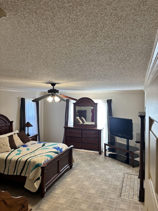 bedroom with a ceiling fan, ornamental molding, a textured ceiling, and light colored carpet