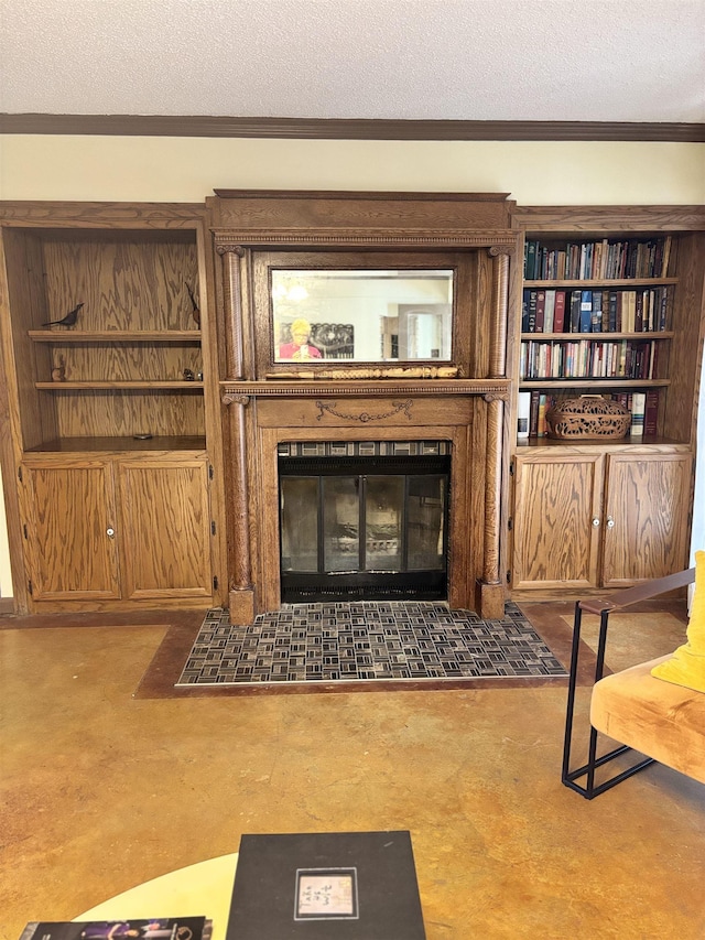 interior space featuring a textured ceiling, ornamental molding, and a tile fireplace