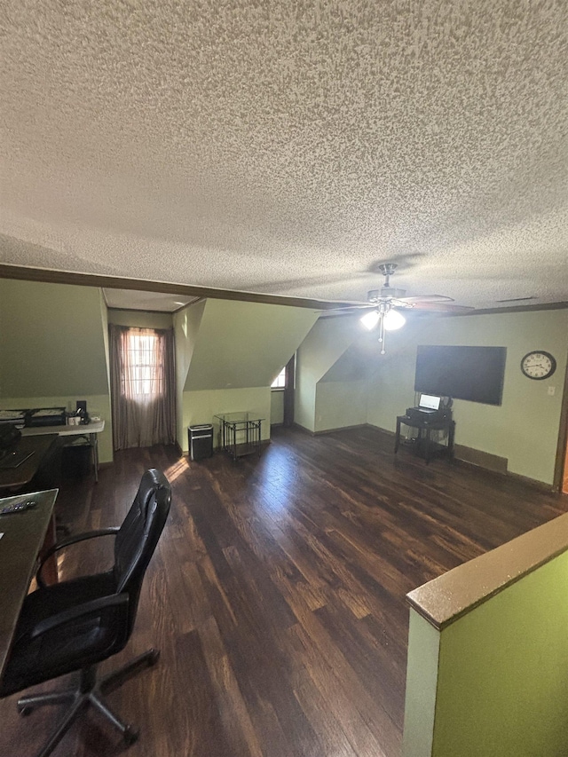 unfurnished office featuring lofted ceiling, ceiling fan, a textured ceiling, and wood finished floors