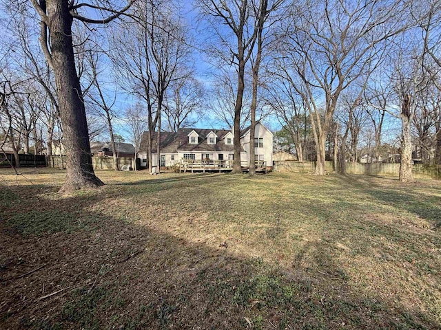 view of yard with a deck and fence