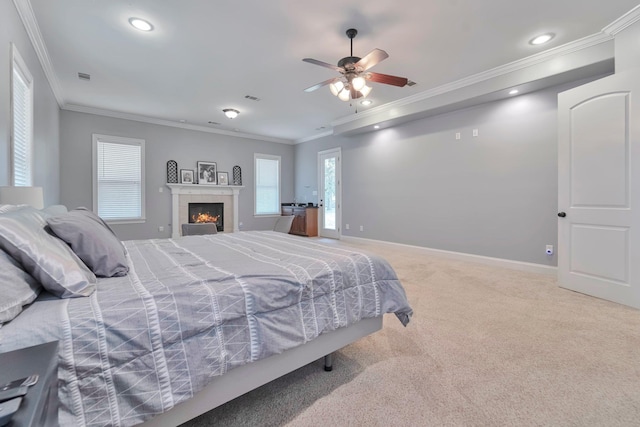 bedroom featuring recessed lighting, carpet flooring, baseboards, a tiled fireplace, and crown molding