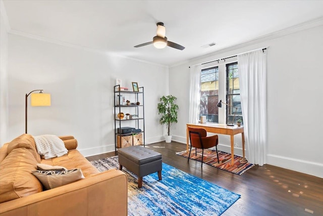 interior space featuring ornamental molding, baseboards, and wood finished floors