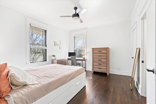 bedroom with dark wood-style floors, multiple windows, and crown molding