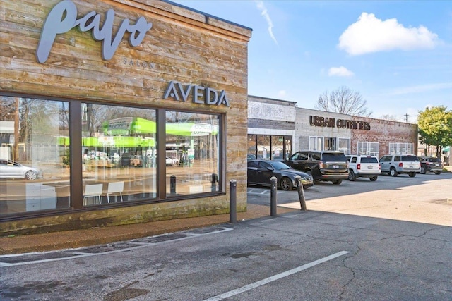 view of building exterior featuring uncovered parking