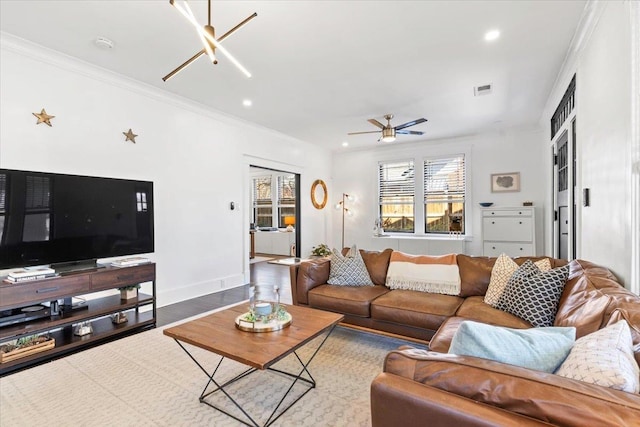 living room featuring recessed lighting, visible vents, and crown molding