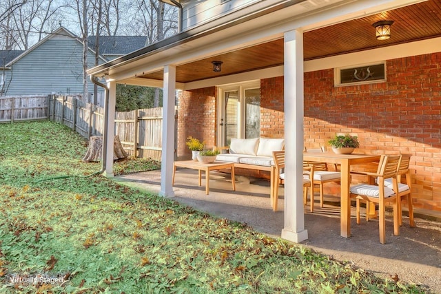 view of patio / terrace with fence and an outdoor living space