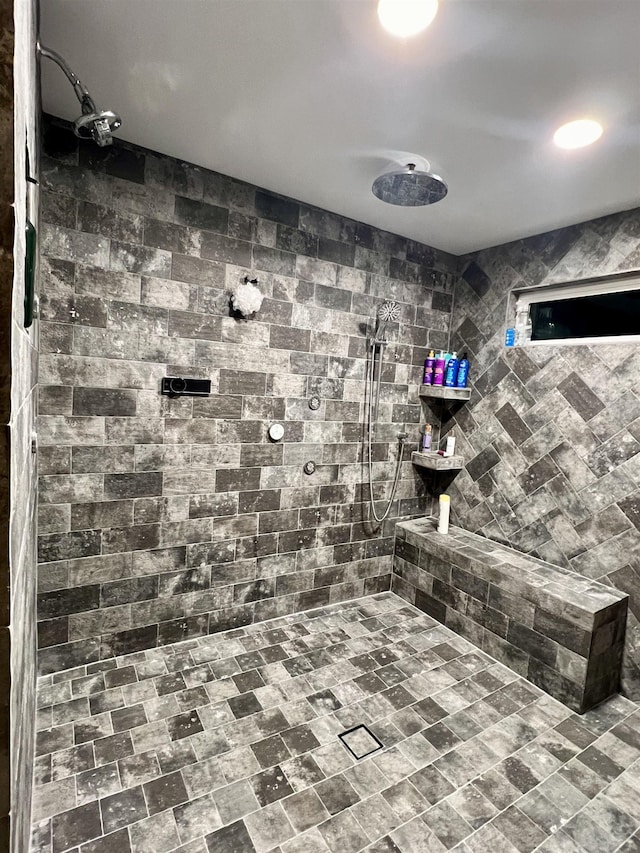 full bath with a tile shower