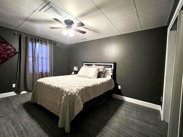 bedroom featuring ceiling fan, wood finished floors, visible vents, and baseboards