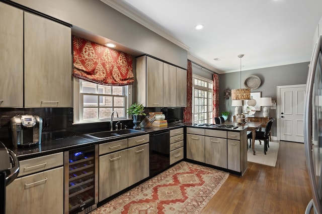 kitchen featuring black dishwasher, beverage cooler, dark countertops, crown molding, and a sink