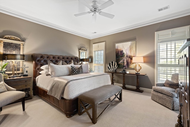 bedroom with multiple windows, visible vents, and light colored carpet