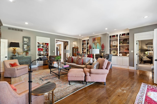 living room featuring recessed lighting, wood-type flooring, visible vents, and crown molding