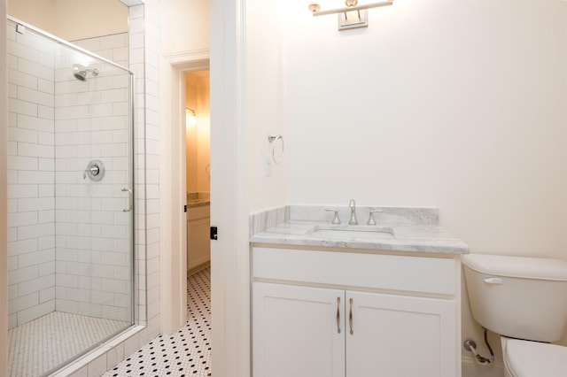 full bathroom with toilet, a shower stall, and vanity