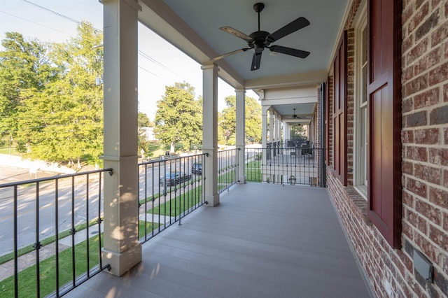 balcony with a porch and a ceiling fan