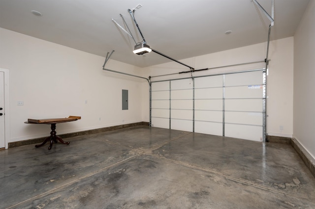 garage featuring baseboards, electric panel, and a garage door opener