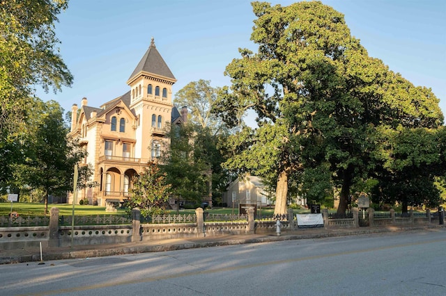 view of building exterior featuring a fenced front yard