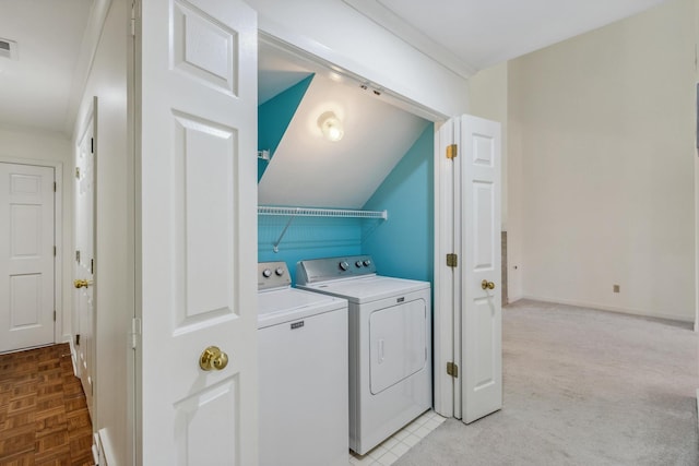 clothes washing area with laundry area, baseboards, visible vents, and independent washer and dryer