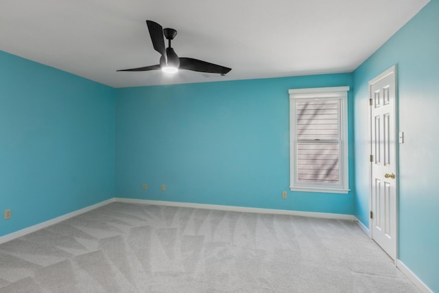 unfurnished room featuring baseboards, a ceiling fan, and carpet flooring