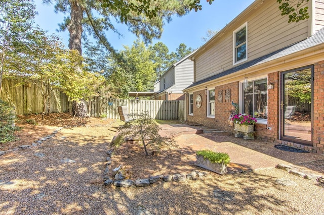 view of yard featuring a fenced backyard and a patio