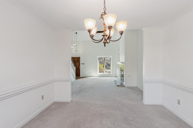 interior space featuring baseboards, light colored carpet, crown molding, a fireplace, and a notable chandelier