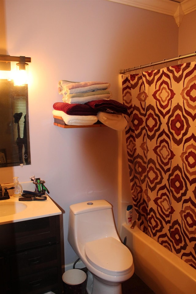 bathroom featuring ornamental molding, vanity, and toilet