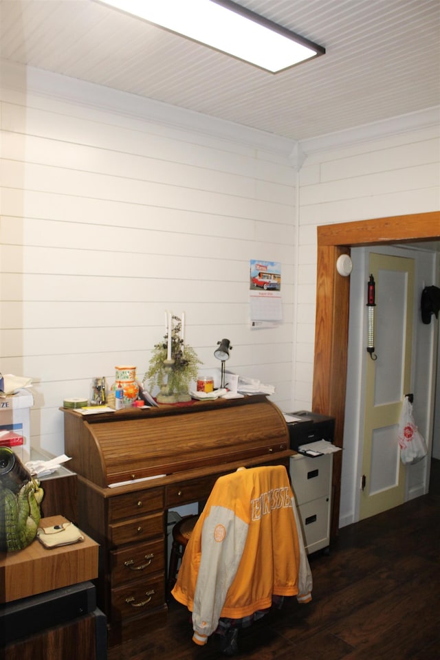 interior space featuring ornamental molding and dark wood-style flooring