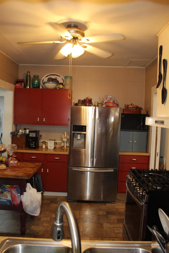 kitchen with ceiling fan and appliances with stainless steel finishes