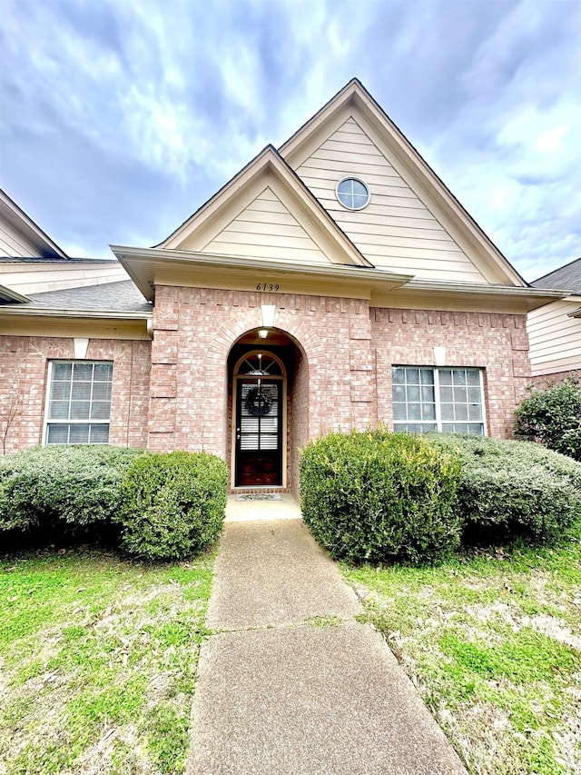 entrance to property with brick siding