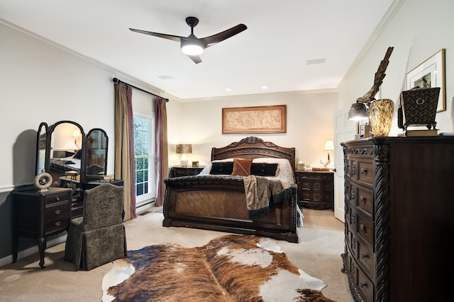 bedroom featuring visible vents, ornamental molding, a ceiling fan, and light colored carpet