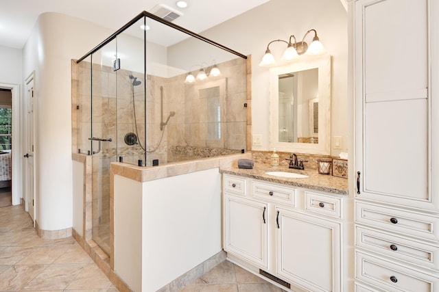 bathroom with recessed lighting, visible vents, a shower stall, vanity, and tile patterned flooring