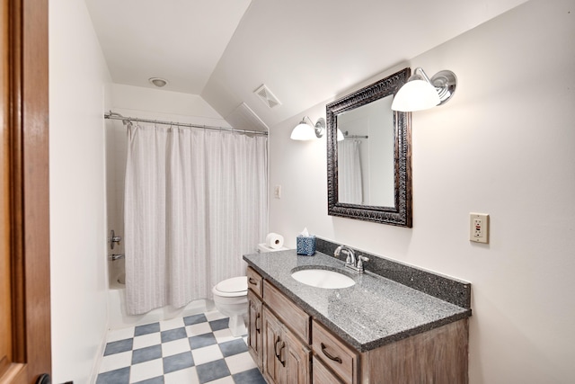 bathroom with visible vents, toilet, vaulted ceiling, vanity, and tile patterned floors