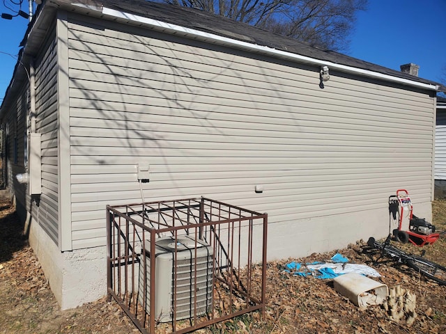 view of side of property with central AC