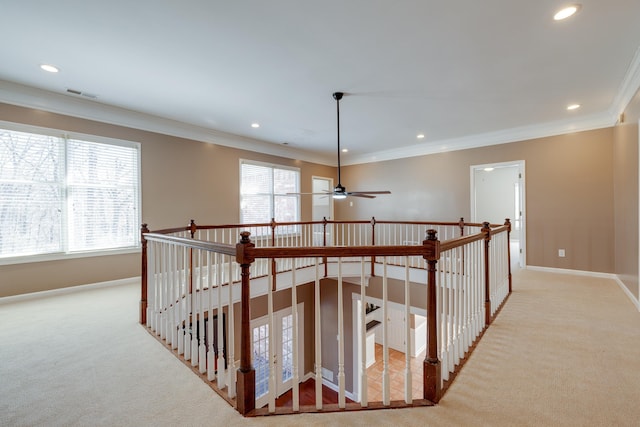 hallway featuring baseboards, visible vents, crown molding, carpet flooring, and recessed lighting