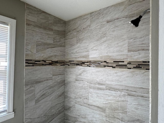 full bathroom with a tile shower