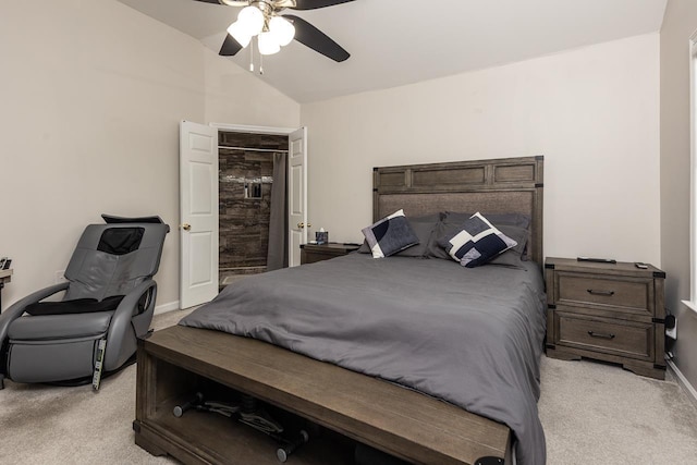 bedroom with baseboards, vaulted ceiling, a ceiling fan, and light colored carpet