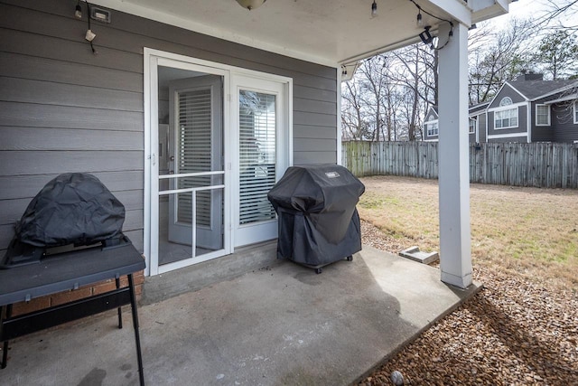 view of patio / terrace featuring area for grilling and fence