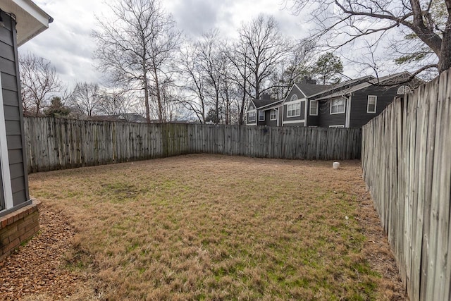 view of yard featuring a fenced backyard