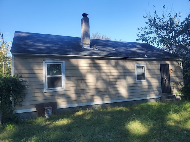 view of side of property featuring entry steps