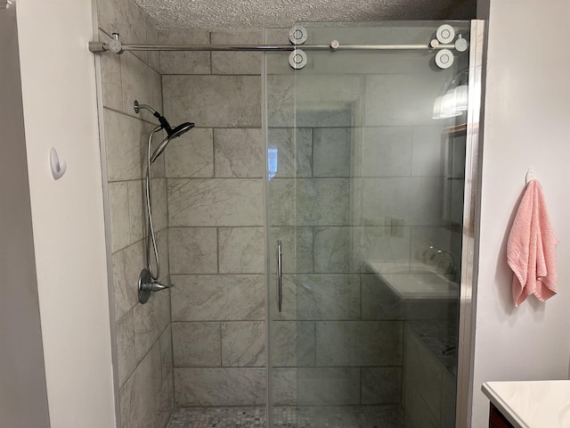 full bathroom featuring a shower stall and vanity