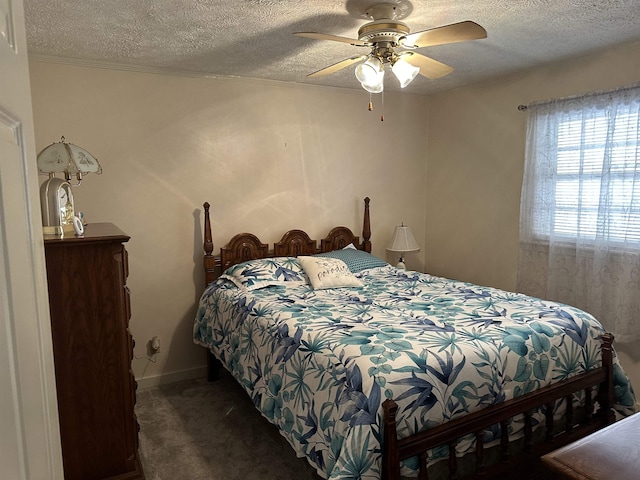 bedroom with a textured ceiling, ceiling fan, carpet flooring, and baseboards