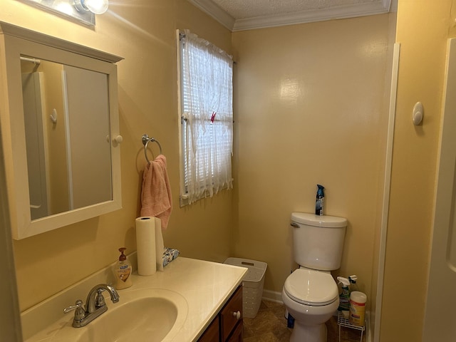 bathroom featuring ornamental molding, baseboards, vanity, and toilet