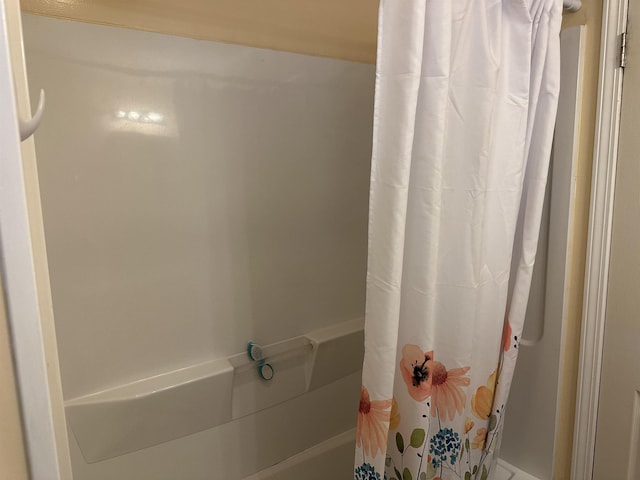 bathroom featuring curtained shower