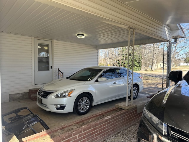 view of vehicle parking featuring a carport